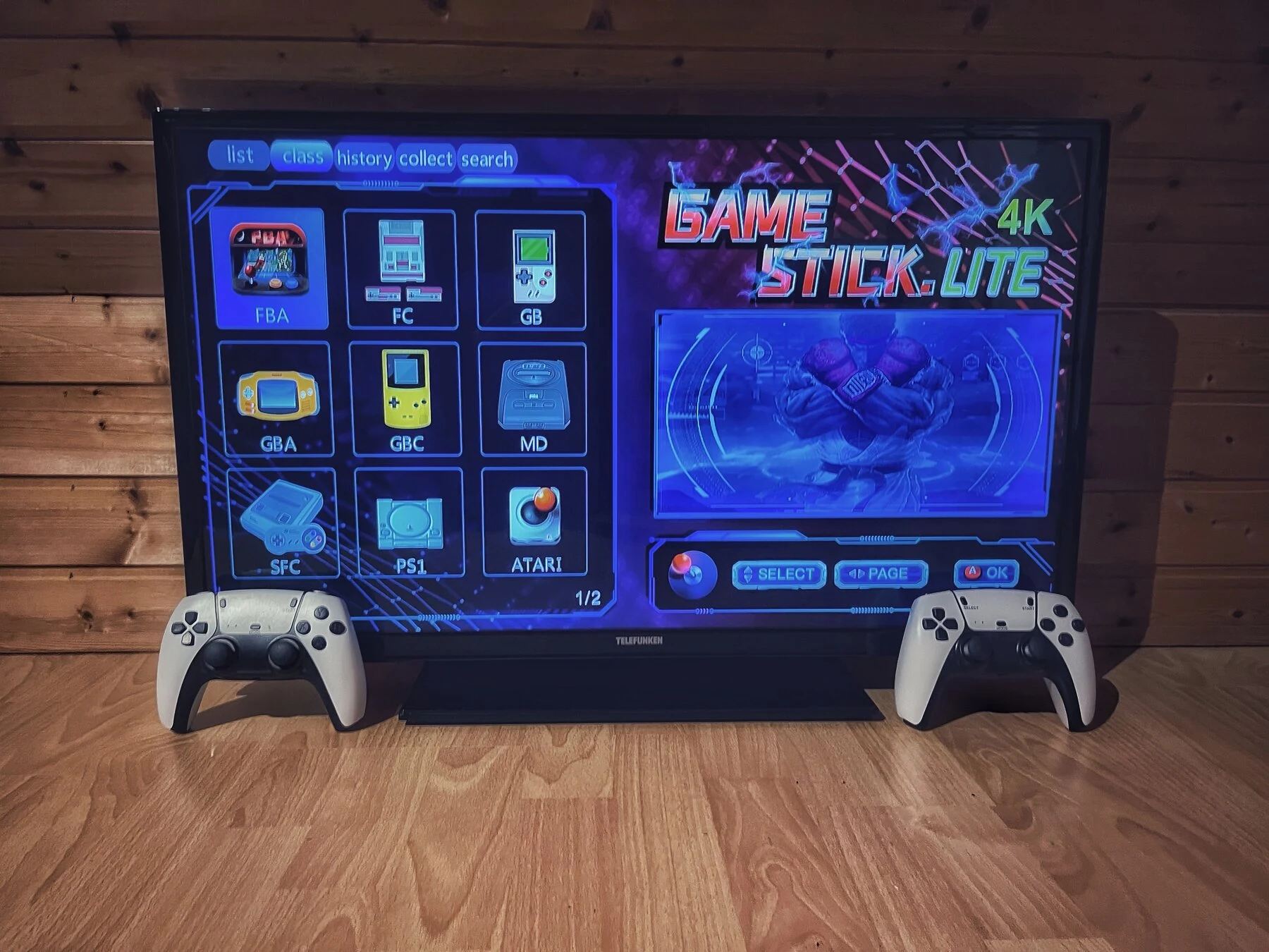 Retro-Konsole mit Controllern vor dem TV im Dachstudio
